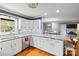 Spacious kitchen featuring white cabinets, granite countertops, and a large island at 645 Sunridge Dr, Lincolnton, NC 28092