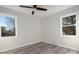 Spacious bedroom with grey flooring and large windows at 7704 Cedar Bluff Ln, Charlotte, NC 28227