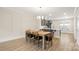 Dining area with a farmhouse table and kitchen views at 1094 Herrons Ferry Rd, Rock Hill, SC 29730