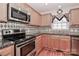 Kitchen with granite countertops, stainless steel appliances, and light wood cabinets at 125 Foy Ln, Statesville, NC 28625