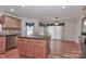 Bright kitchen with island, stainless steel appliances, and hardwood floors at 125 Foy Ln, Statesville, NC 28625