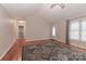 Bright living room with hardwood floors, vaulted ceiling and a cozy area rug at 125 Foy Ln, Statesville, NC 28625