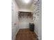 Laundry room with shelves, hanging rod, and tile floor at 1516 Tiana Way, Rock Hill, SC 29732