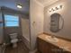 Clean bathroom featuring a tub, toilet and vanity at 2110 Zion Church Rd, Hickory, NC 28602