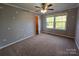 Bright bedroom with grey walls, carpet and ceiling fan at 2110 Zion Church Rd, Hickory, NC 28602