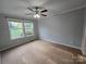 Another bedroom with carpet and large windows at 2110 Zion Church Rd, Hickory, NC 28602
