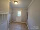 Bright laundry room with exterior access and tile flooring at 2110 Zion Church Rd, Hickory, NC 28602