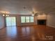 Large living area with hardwood floors and fireplace at 2110 Zion Church Rd, Hickory, NC 28602