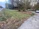 Vacant lot with overgrown grass and some leaves at 3031 Davidson Hwy, Concord, NC 28027