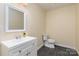 Clean bathroom with white vanity and toilet at 305 Elm St, Lancaster, SC 29720
