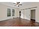 Bedroom with barn door, closet, and ceiling fan at 305 Elm St, Lancaster, SC 29720