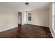 Bedroom with hardwood floors and access to another room at 305 Elm St, Lancaster, SC 29720