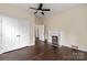 Spacious bedroom with double doors, fireplace, and dark hardwood floors at 305 Elm St, Lancaster, SC 29720