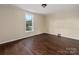 Well-lit bedroom with one window and hardwood floors at 305 Elm St, Lancaster, SC 29720