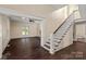 Entryway with hardwood floors, staircase, and views into the living room at 305 Elm St, Lancaster, SC 29720