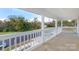 Charming front porch with white railings overlooking a quiet street at 305 Elm St, Lancaster, SC 29720