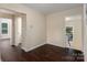 Simple hallway with dark brown hardwood floors at 305 Elm St, Lancaster, SC 29720