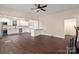 Open concept kitchen with teal accents and stainless steel appliances at 305 Elm St, Lancaster, SC 29720