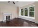 Living room with fireplace and built-in window seat at 305 Elm St, Lancaster, SC 29720