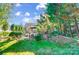 Spacious backyard with mature trees and patio at 3703 Margaret Wallace Rd, Matthews, NC 28105