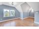 Spacious bedroom with hardwood floors and sloped ceilings at 3703 Margaret Wallace Rd, Matthews, NC 28105