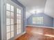 Spacious bedroom with hardwood floors and double doors at 3703 Margaret Wallace Rd, Matthews, NC 28105