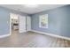 Bright bedroom with hardwood floors and view of backyard at 3703 Margaret Wallace Rd, Matthews, NC 28105