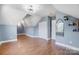 Bright bonus room with hardwood floors, recessed lighting, and ample closet space at 3703 Margaret Wallace Rd, Matthews, NC 28105