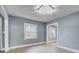 Bright dining room with hardwood floors and large window at 3703 Margaret Wallace Rd, Matthews, NC 28105