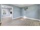Dining area with hardwood floors and neutral walls at 3703 Margaret Wallace Rd, Matthews, NC 28105