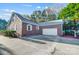 Brick home with attached garage and solar panels at 3703 Margaret Wallace Rd, Matthews, NC 28105