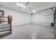 Spacious garage with ample storage and a finished floor at 3703 Margaret Wallace Rd, Matthews, NC 28105