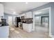 Modern kitchen with white cabinets, granite countertops, and stainless steel appliances at 3703 Margaret Wallace Rd, Matthews, NC 28105