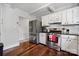 Updated kitchen with stainless steel appliances and white shaker cabinets at 400 Neighbors Dr, Midland, NC 28107