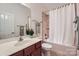 Clean bathroom with a bathtub, shower, and updated vanity at 8235 Parknoll Dr, Huntersville, NC 28078