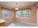 Simple dining area with hardwood floors and two windows at 103 Prestwick Ct, Salisbury, NC 28146