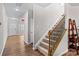 Interior view showing staircase, hardwood floors, and entryway at 140 Falls Cove Dr, Troutman, NC 28166