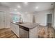 Kitchen island with granite countertop, sink, and dishwasher at 3702 Small Ave, Charlotte, NC 28269