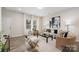 Bright and airy living room featuring neutral decor and hardwood floors at 3702 Small Ave, Charlotte, NC 28269