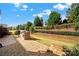 Landscaped backyard with stone patio and grilling area at 4022 Blackburn Ct, Fort Mill, SC 29707