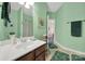 Light green bathroom with vanity, toilet, and shower at 4022 Blackburn Ct, Fort Mill, SC 29707