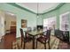 Dining room with hardwood floors and a light green accent wall at 4022 Blackburn Ct, Fort Mill, SC 29707