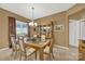 Formal dining room with hardwood floors and a glass-top dining table at 4022 Blackburn Ct, Fort Mill, SC 29707