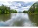 Serene lake surrounded by lush greenery at 4022 Blackburn Ct, Fort Mill, SC 29707