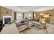 Living room with fireplace, couches, and a large area rug at 4022 Blackburn Ct, Fort Mill, SC 29707