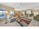 Spacious living room features ample seating, a decorative rug, and access to the dining area at 4022 Blackburn Ct, Fort Mill, SC 29707
