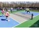 Active pickleball game in progress on community court at 4022 Blackburn Ct, Fort Mill, SC 29707