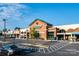 Exterior view of a shopping center anchored by Harris Teeter, featuring additional stores and ample parking at 4022 Blackburn Ct, Fort Mill, SC 29707