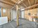 Unfinished basement with two doors and concrete floor at 504 N Pine Ln, Wadesboro, NC 28170