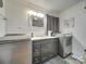 Modern bathroom with vanity, washer, and dryer at 504 N Pine Ln, Wadesboro, NC 28170